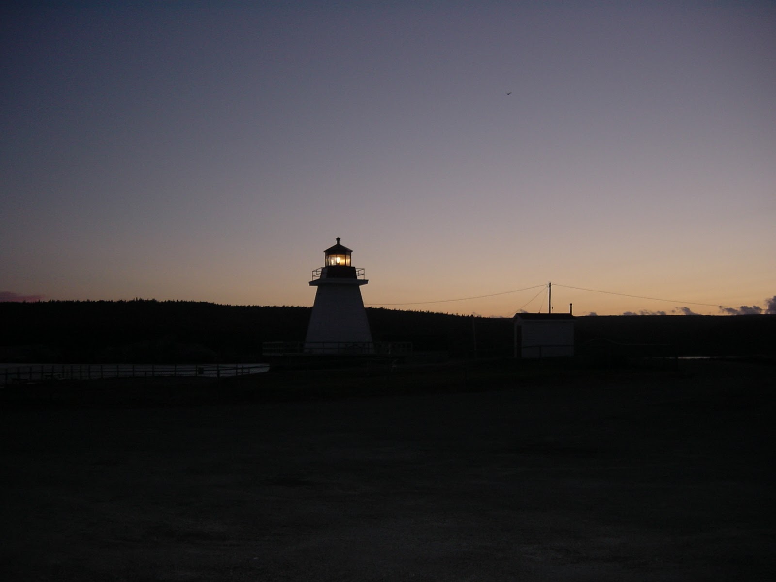 Lighthouse in fishing town. Cape Breton, NS