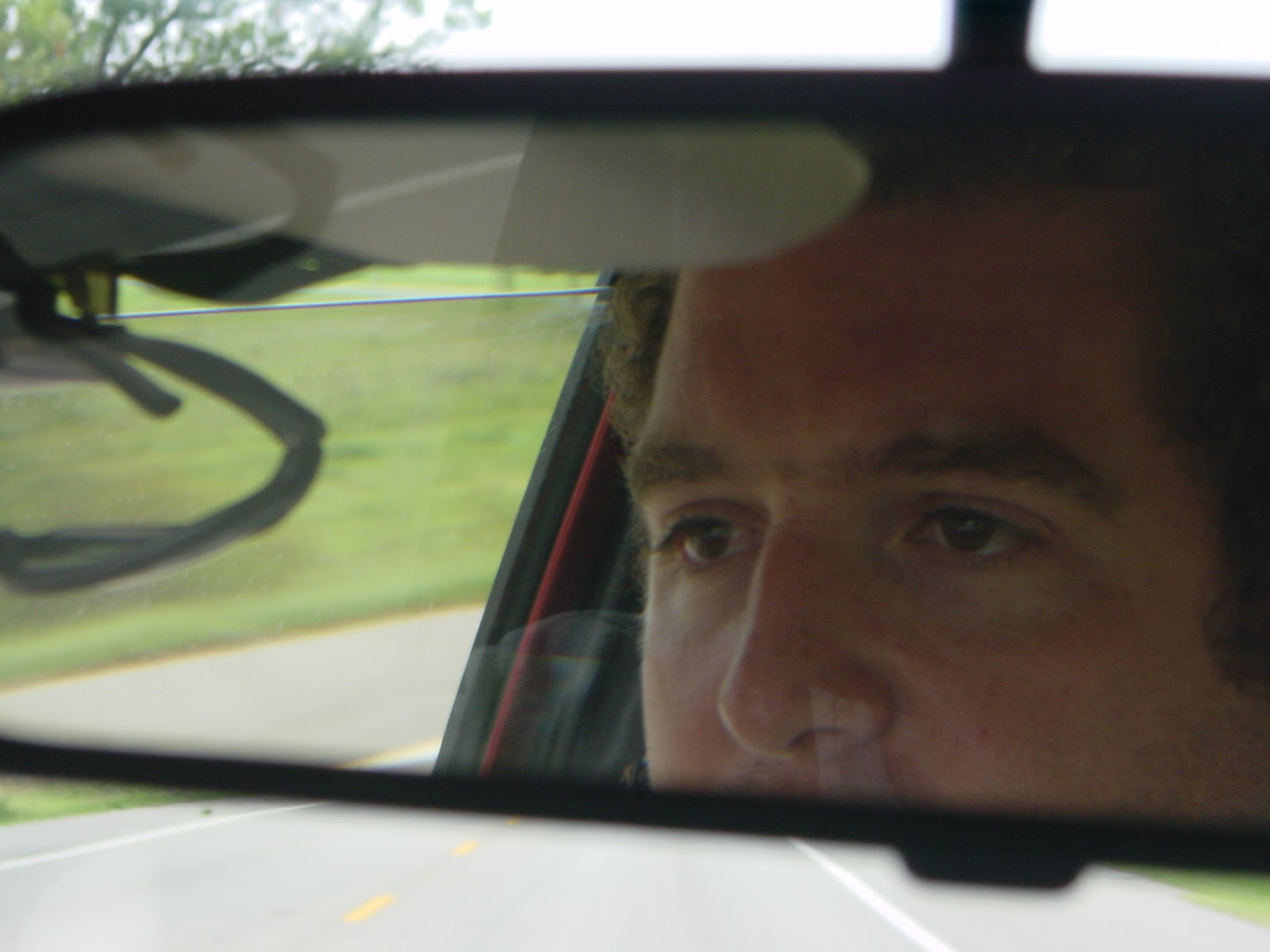 Self-portrait while driving.