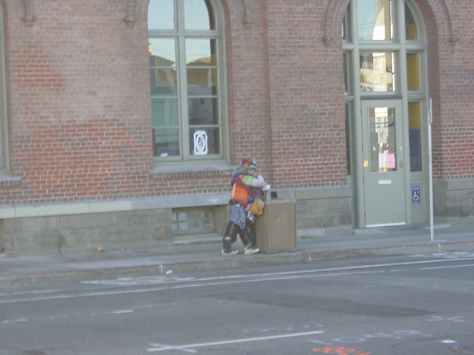 Man on corner of Folsom and 11th. San Francisco, CA